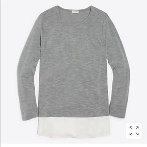 Gray long sleeve top.